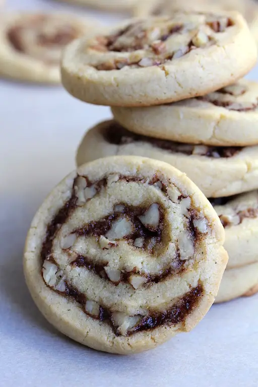 Image of recipe, Pecan Cinnamon Swirl Cookies, stacked on top of each other.