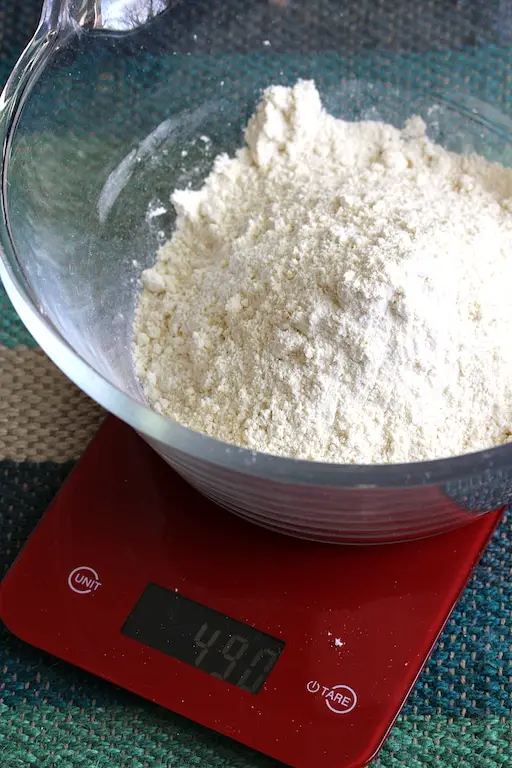 Best Gluten-Free Bread Flour being weighed on a kitchen scale