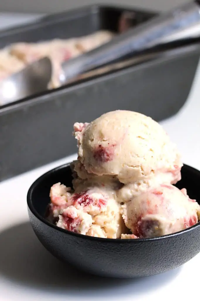 image peanut-butter jam ice cream in a small black bowl