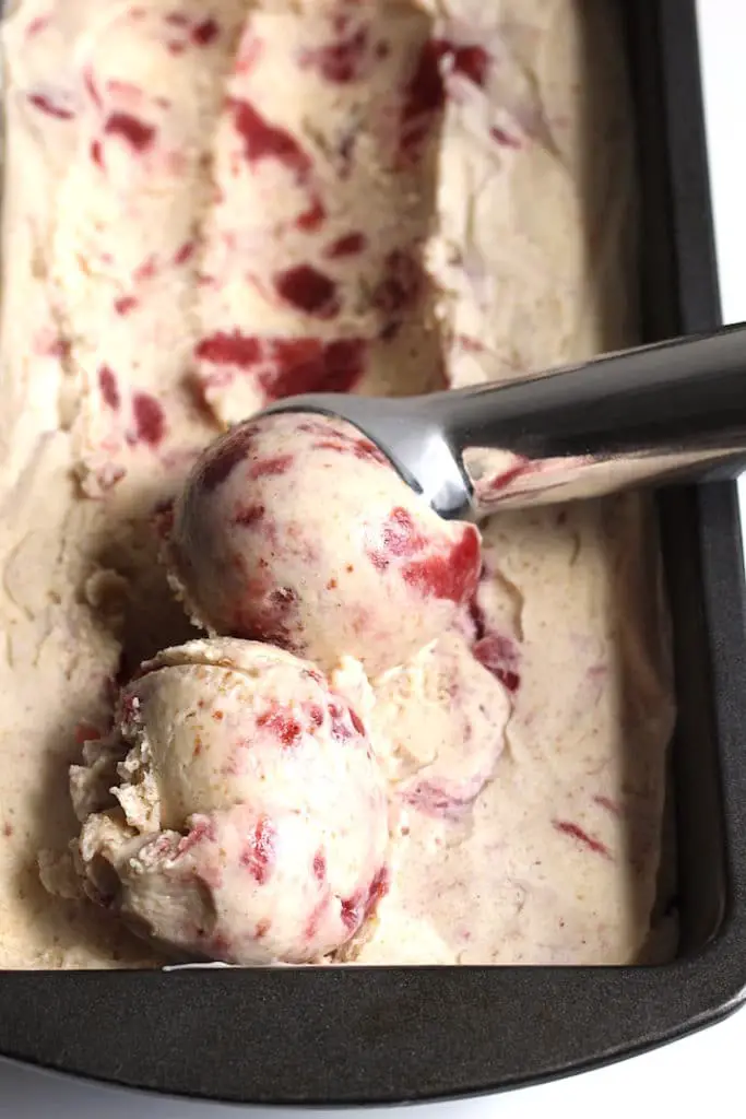 Close up of peanut-butter jam ice cream being scooped