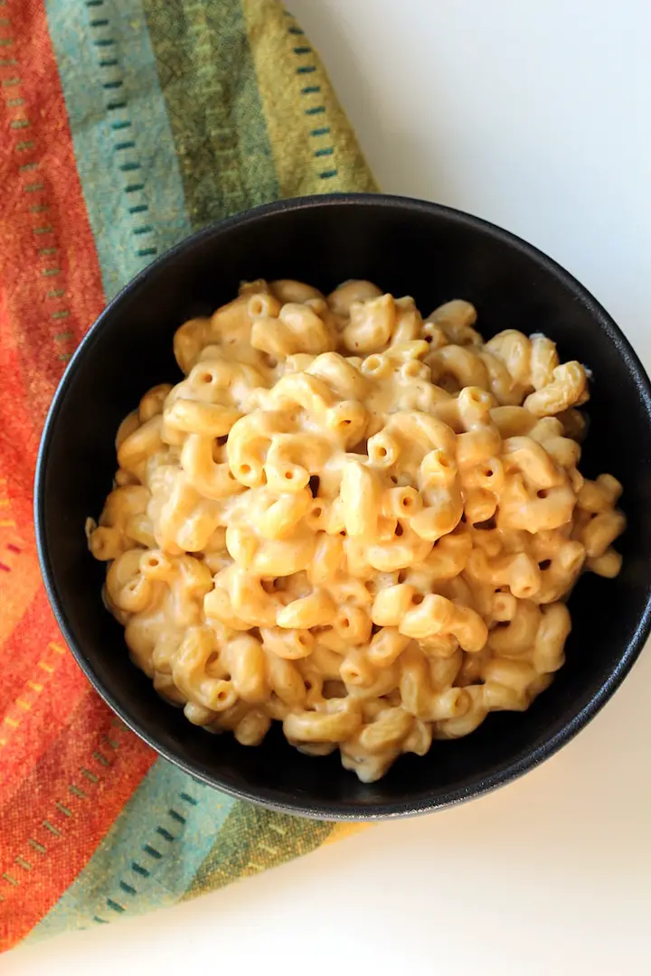 overhead image of Easy Stovetop Vegan Mac and Cheese in a black bowl