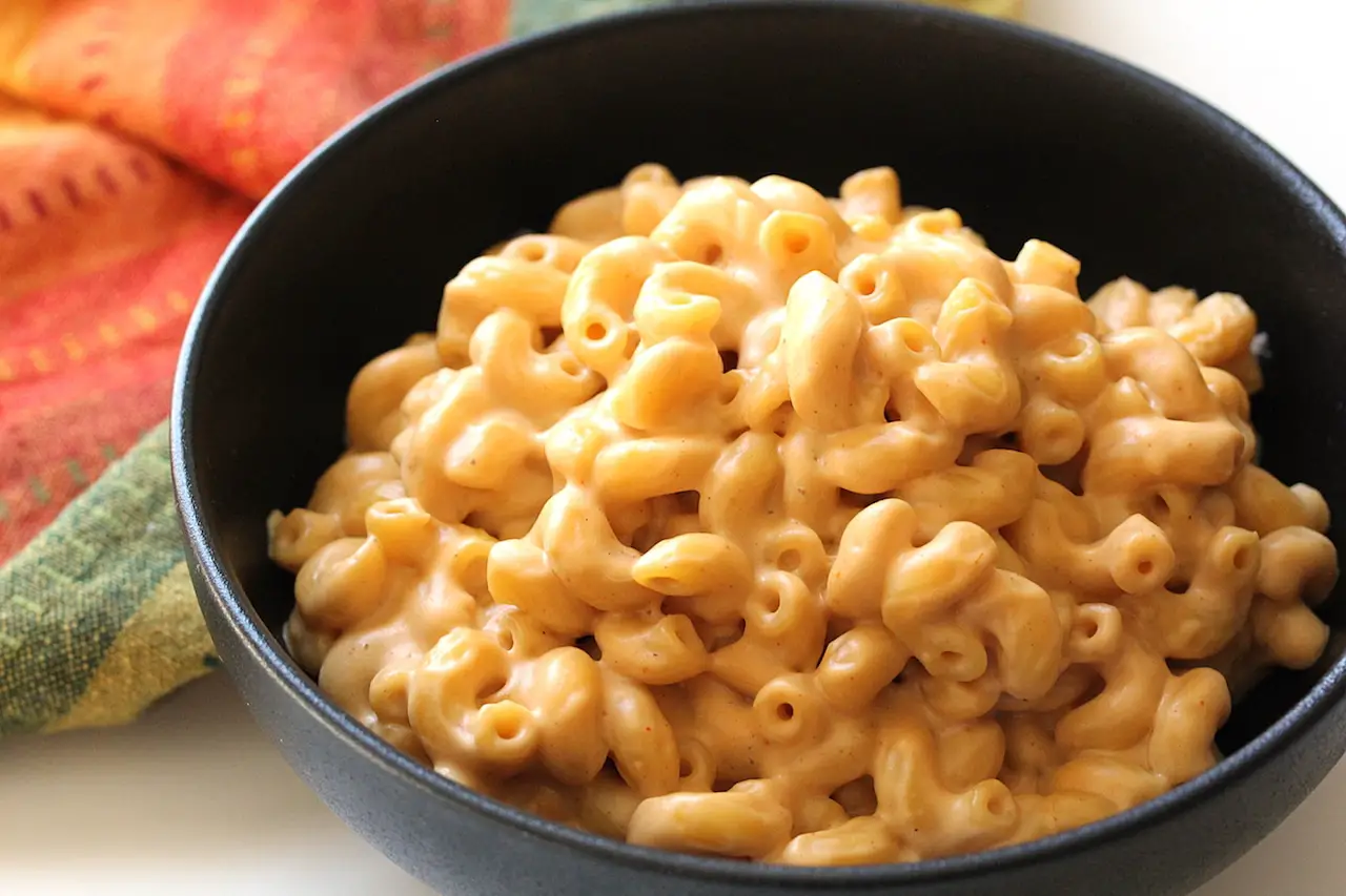 close up image of Mac and cheese in a black bowl
